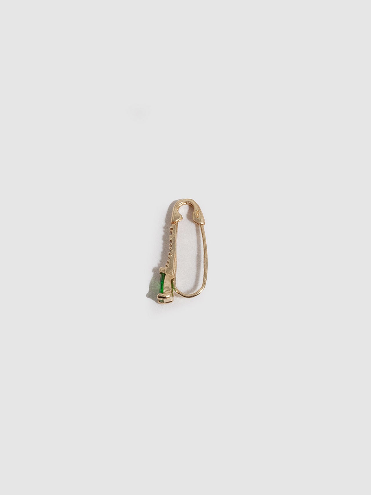 14kt Yellow Gold Mini Diamond Tsavorite Safety Pin pictured on white background. Laying on its side. 