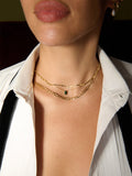 Close up shot of the 14kt Yellow Gold Oval Gemstone Necklace pictured on model. 