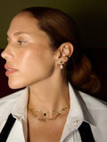 14kt Yellow Gold Teardrop Stud Earrings pictured on model in first piericing.