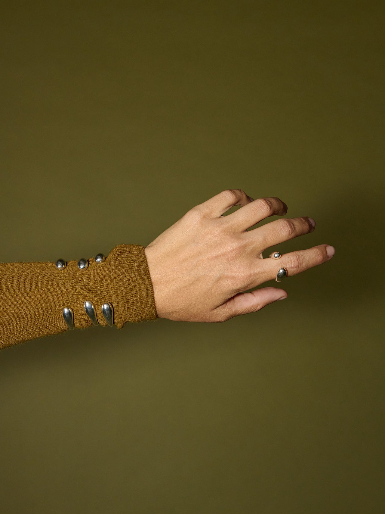 Sterling Silver Omri Cuff Bracelet pictured on models wrist.