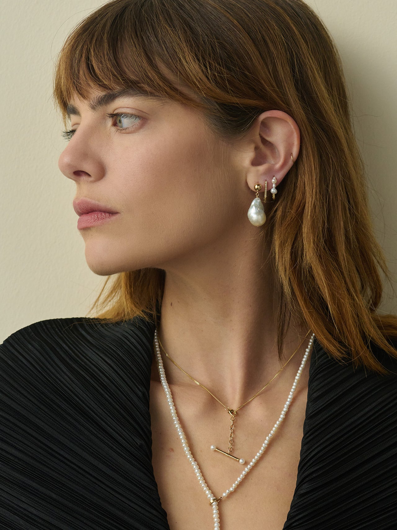 14kt Yellow Gold & Freshwater Drop Earrings pictured on model. 
