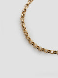 14kt Yellow Gold Rolo Chain Bracelet close up on light grey background. 