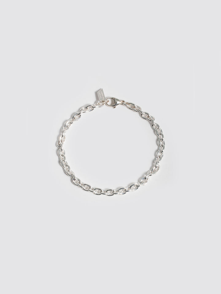 Sterling Silver Cable Chain Bracelet pictured on light grey background. 
