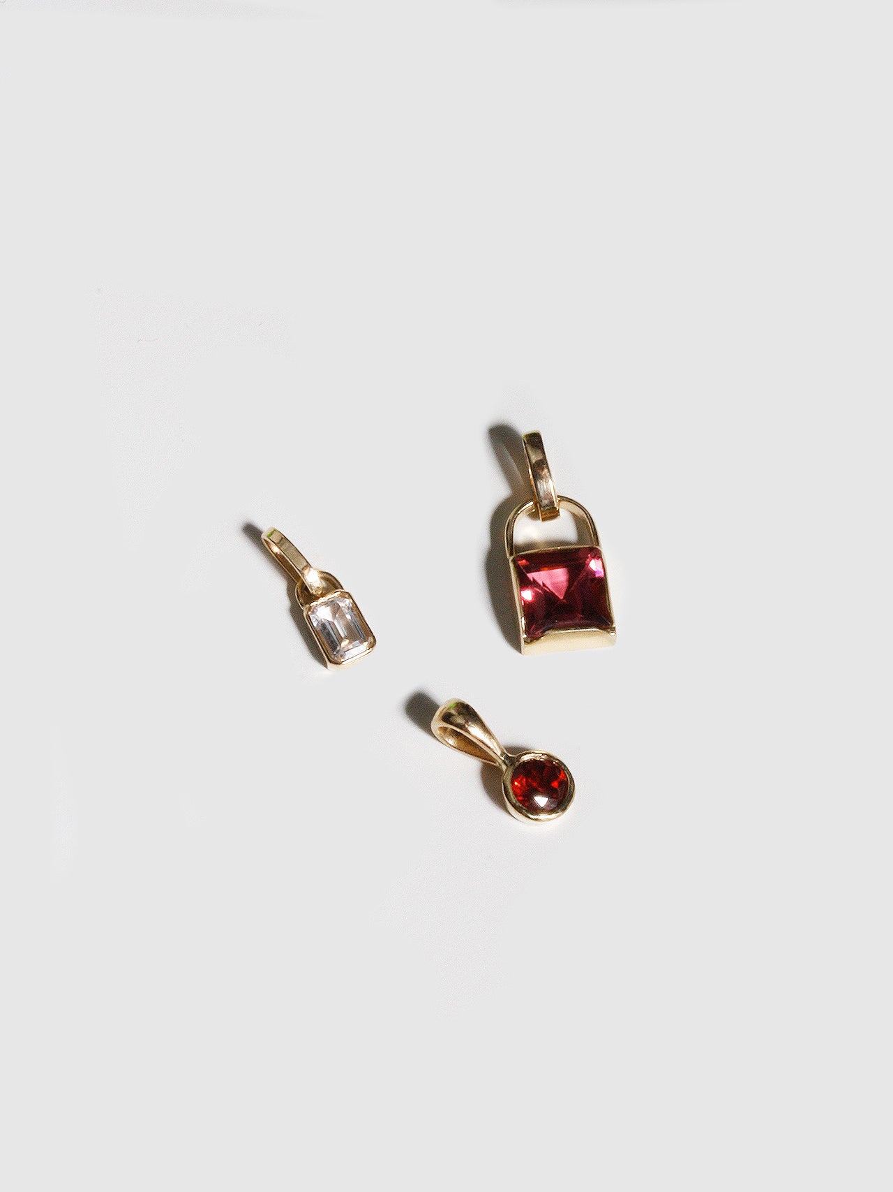 Charms pictured on light grey background. 