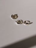 Three Ouroboros Rings pictured on light grey background. Ouroboros Ring 