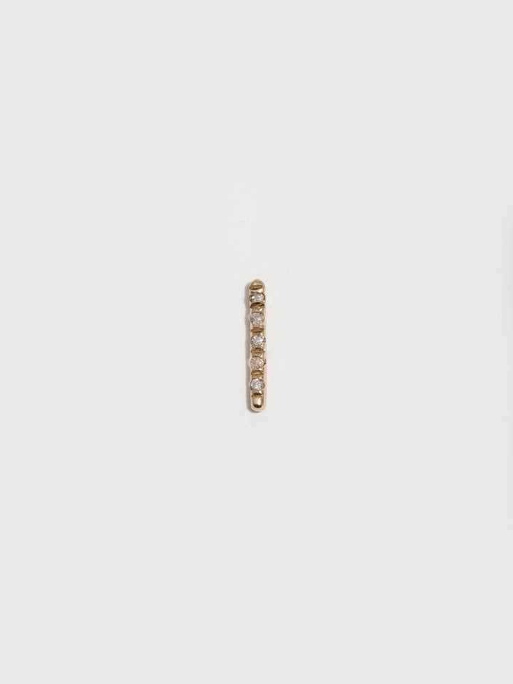 14kt Yellow Gold Solo Diamond Rod Stud Earring pictured on light grey background. Single.