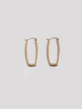 14kt Yellow Gold Elongated Hoops pictured on light grey background.