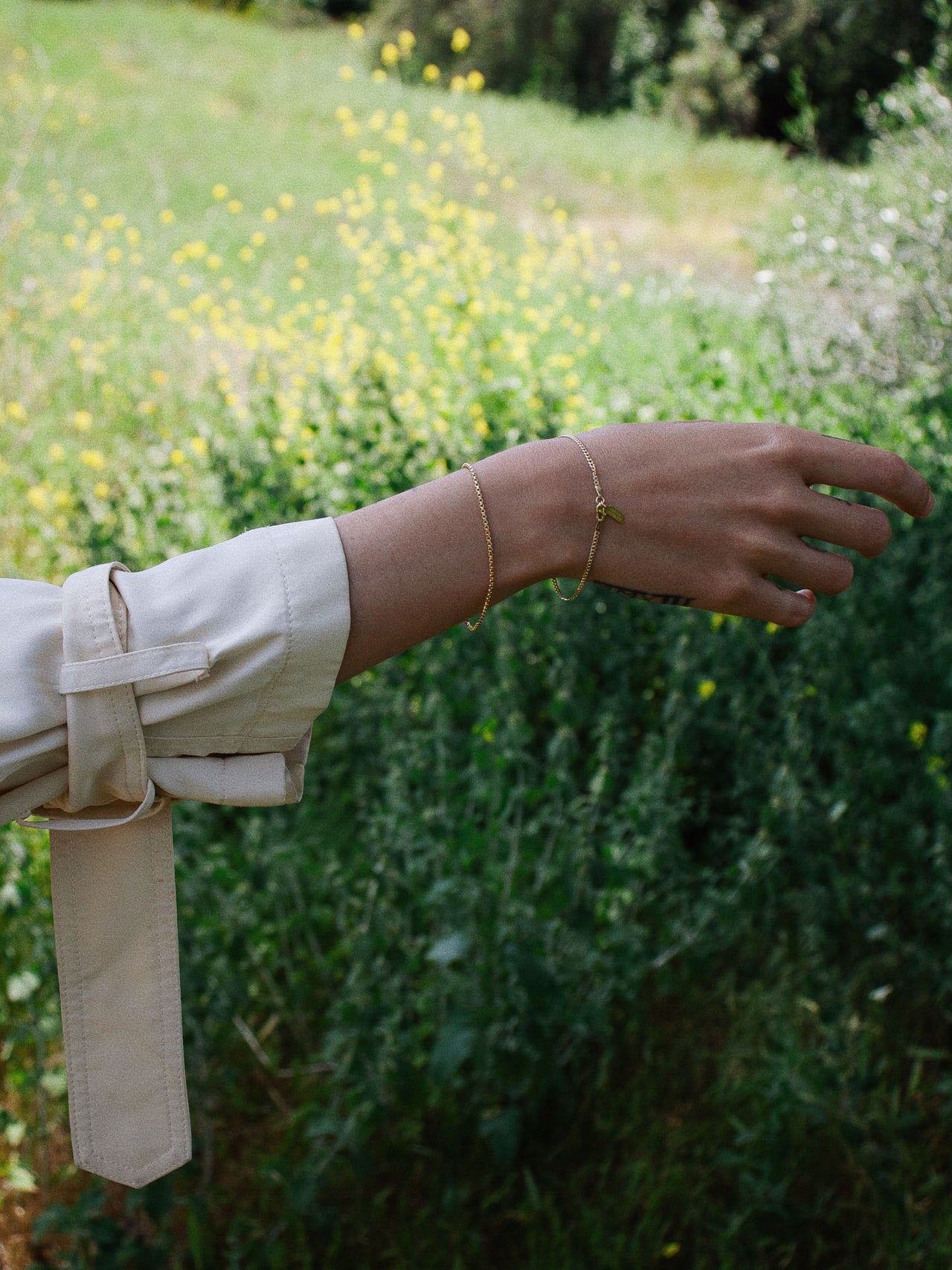 10kt Yellow Gold Squared Box Link Bracelet pictured on models wrist. 