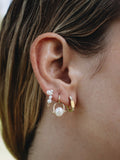 Mini Mixed Pearl Safety Pin Earring pictured in models third piercing. 
