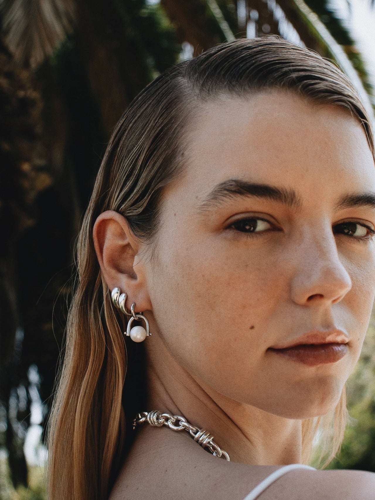 Sterling Silver Torque Huggies pictured on model. Double stacked in second and third piercings. 