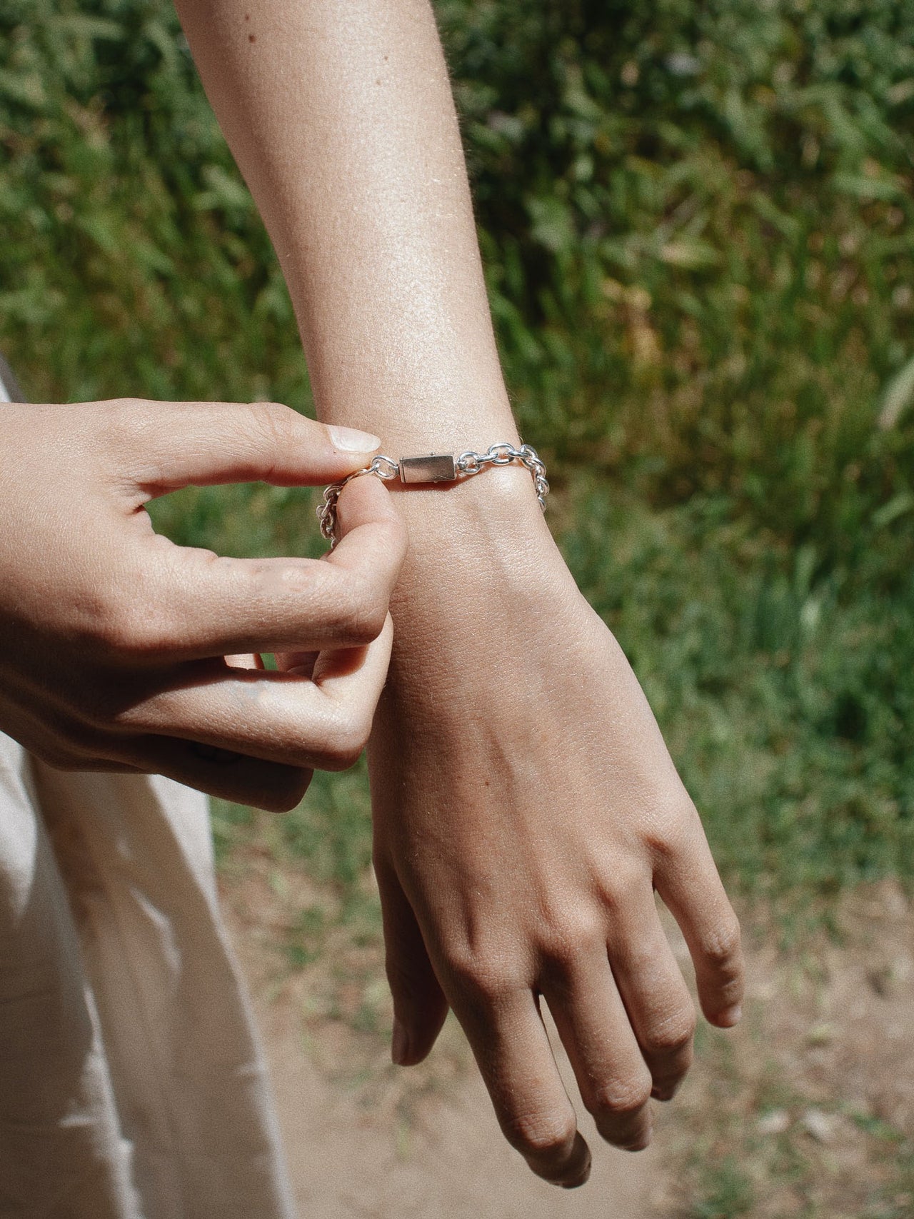  Silver Box Lock Cable Bracelet pictured on model with lock shown in the front 