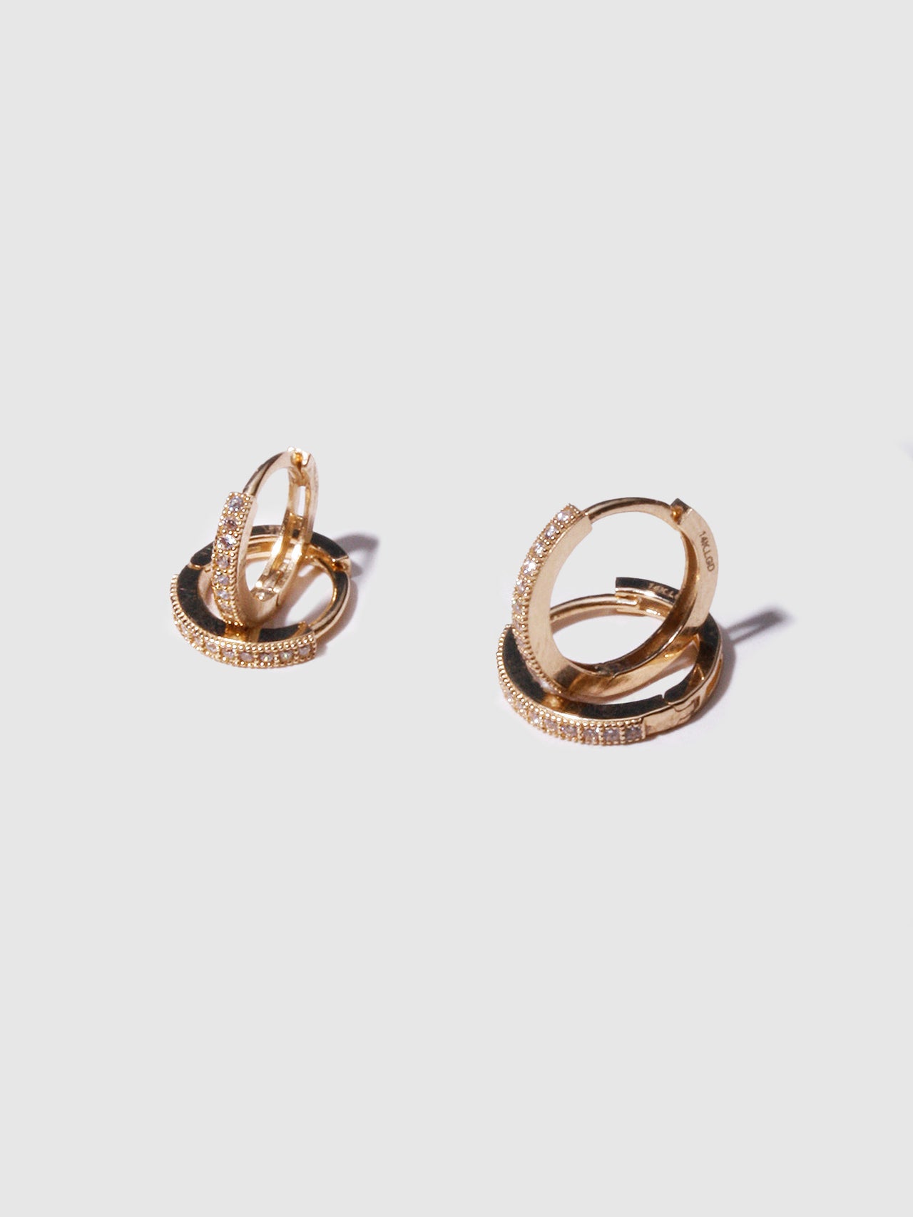 14kt Yellow Gold Pave Hoops pictured next to the Baby Pave Hoops.