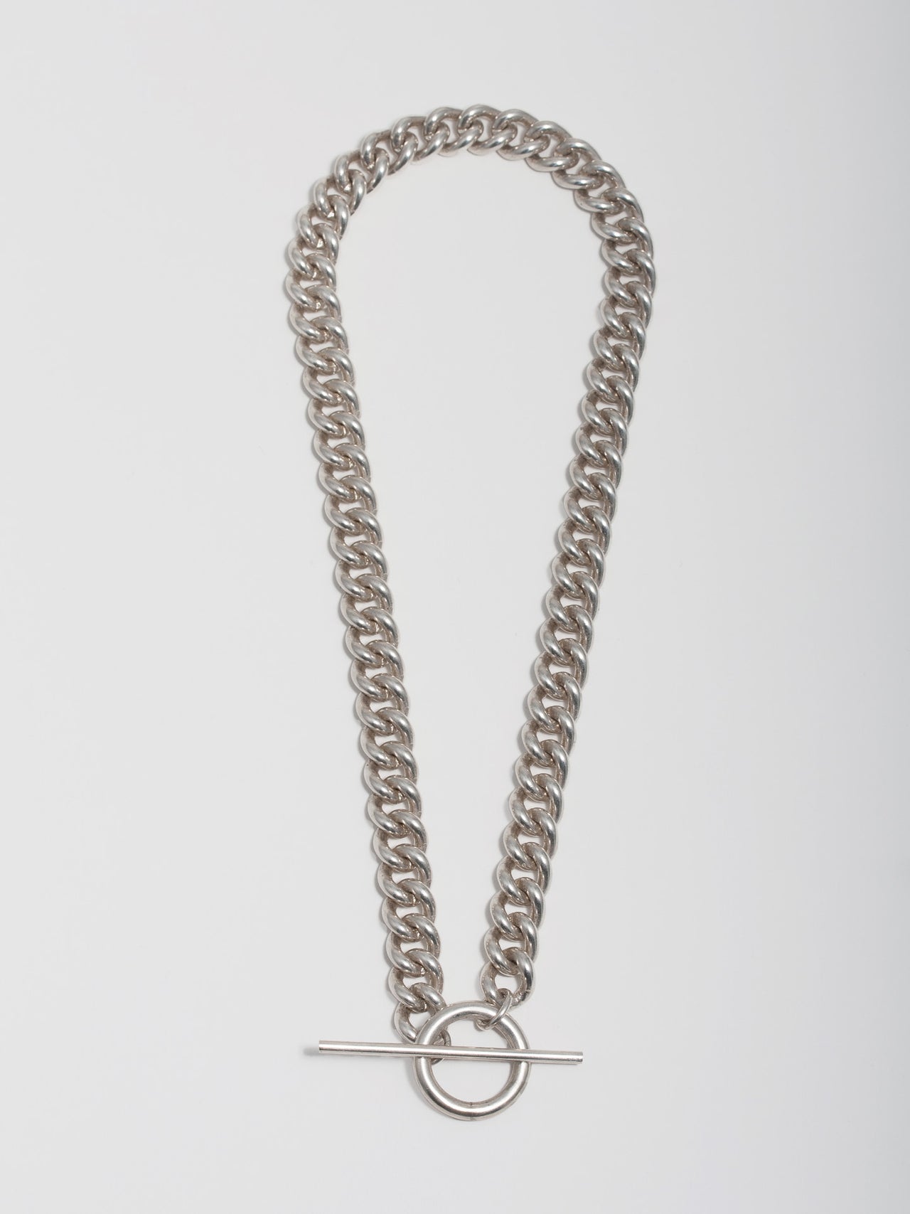 Sterling Silver Solid XL Industrial Curb &amp; Toggle Necklace pictured on light grey background. 