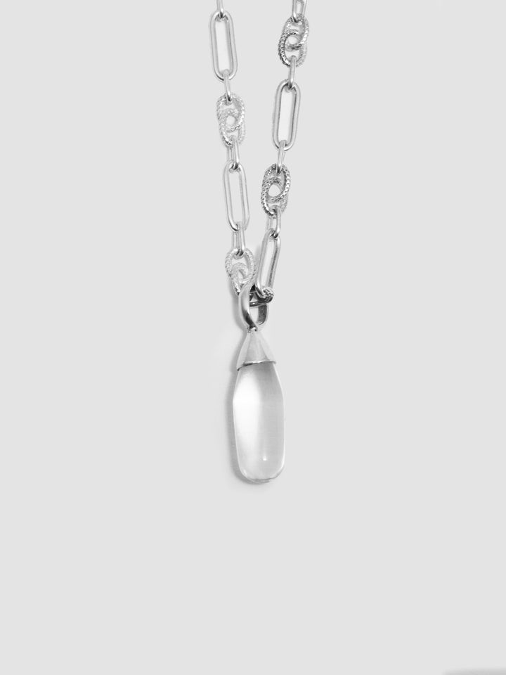 Sterling Silver Stone Teardrop Necklace pictured close up on light grey background. 