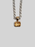 14kt Yellow Gold Citrina Medallion Pendant pictured on the Sterling Silver Classic Rolo Chain. Light grey background. 
