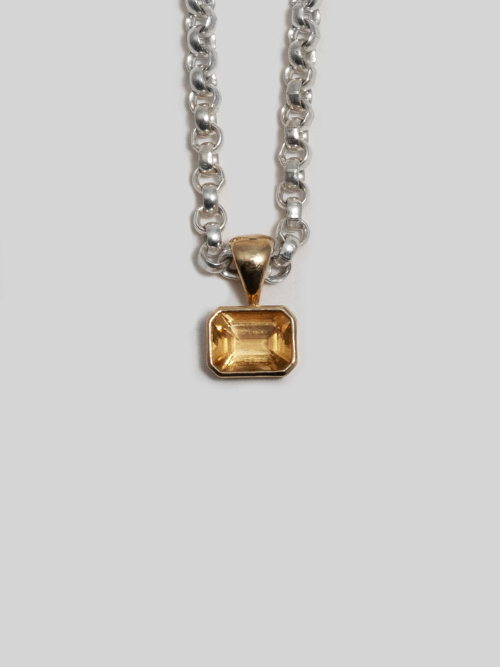 14kt Yellow Gold Citrina Medallion Pendant pictured on the Sterling Silver Classic Rolo Chain. Light grey background. 