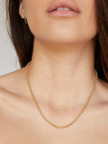 14kt Yellow Gold Rolo Chain pictured on model. 