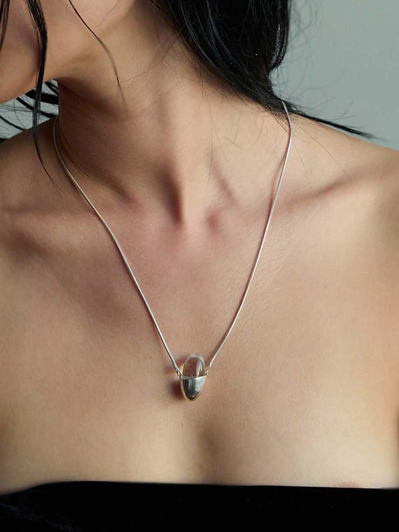 Sterling Silver Ovo Quartz Necklace pictured on model.