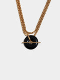 Vermeil Onyx & Toggle Wrap Necklace pictured close up on light grey background. 
