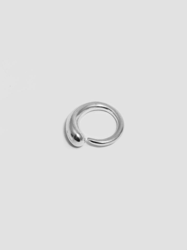 Sterling Silver Ouroboros Ring pictured on light grey background. 