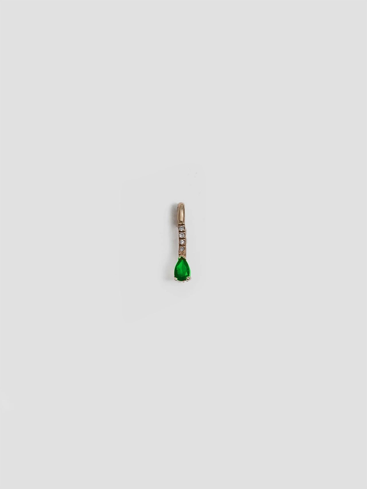 14kt Yellow Gold Mini Diamond Tsavorite Safety Pin pictured on white background.