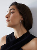 Sterling Silver Pli Hoops pictured on model.