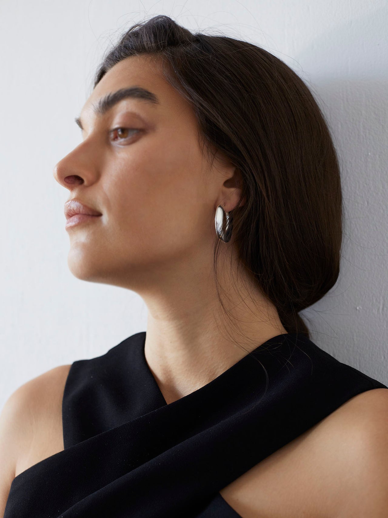 Sterling Silver Pli Hoops pictured on model.