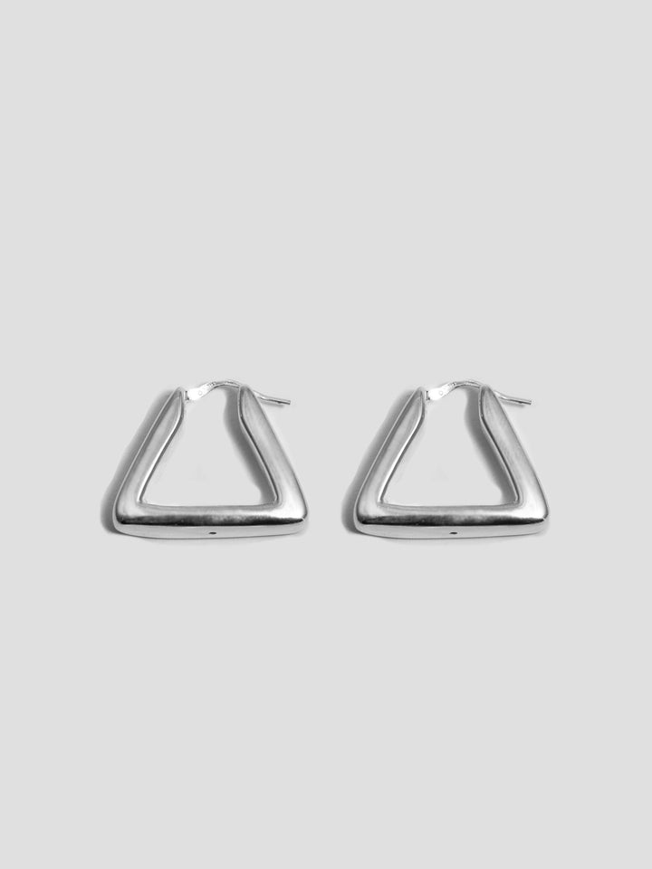 Sterling Silver Triangle Hoops pictured laying flat on light grey background. 