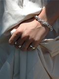 Sterling Silver Whorl Chain Bracelet pictured on models wrist. 