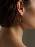 14kt Yellow Gold Elongated Hoops pictured on model.