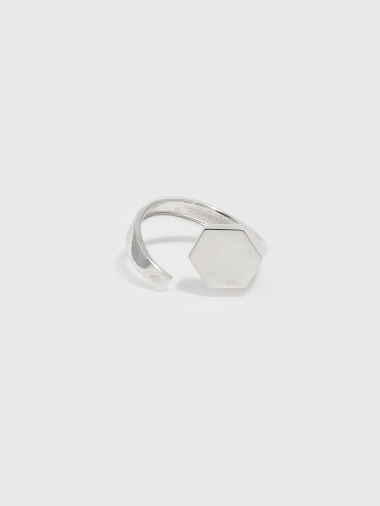 Sterling Silver Hexagon ID Signet Ring pictured on light grey background. 