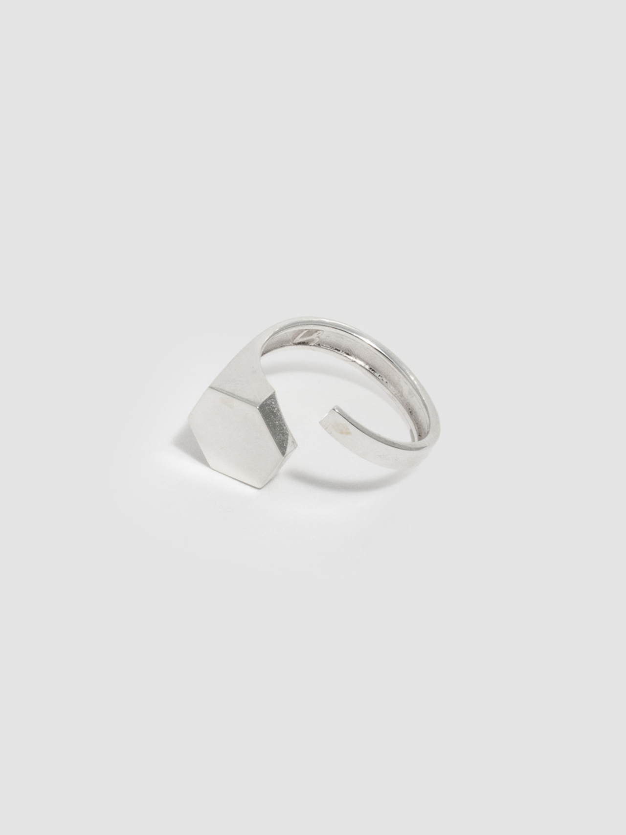 Sterling Silver Hexagon ID Signet Ring pictured on light grey background. 
