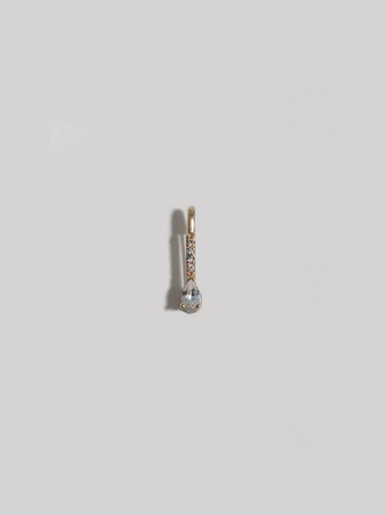 14kt Yellow Gold Mini Diamond White Sapphire Safety Pin pictured on white background.