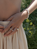 Sterling Silver Whorl Chain Bracelet pictured on models wrist.