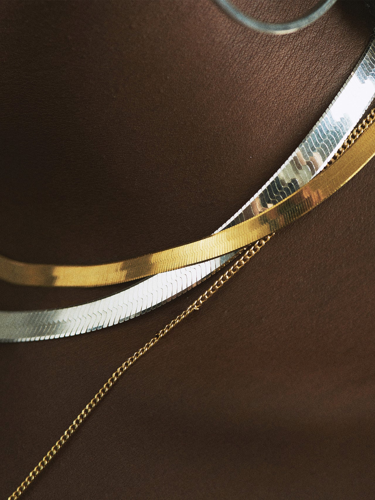 14kt Yellow Gold Petite Havana Chain Necklace pictured on model. Close up of chain on skin. 