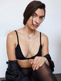 Sterling Silver Stone Teardrop Necklace pictured on model. Styled with other jewelry.