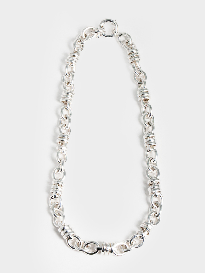 Sterling Silver Whorl Chain Necklace pictured on light grey background. 