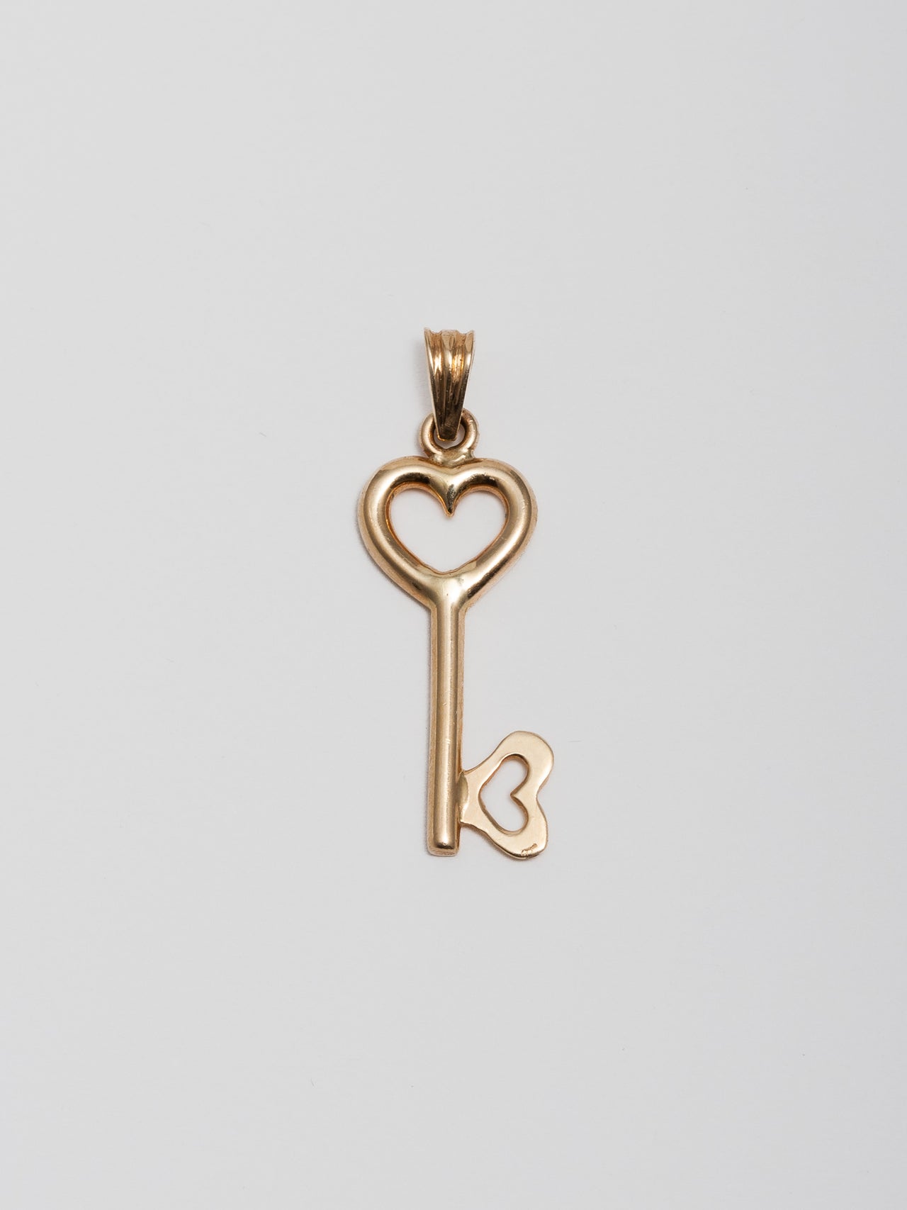 Gold key pendant