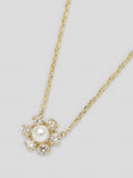 Product image of white topaz floret necklace with thin yellow gold chain. 