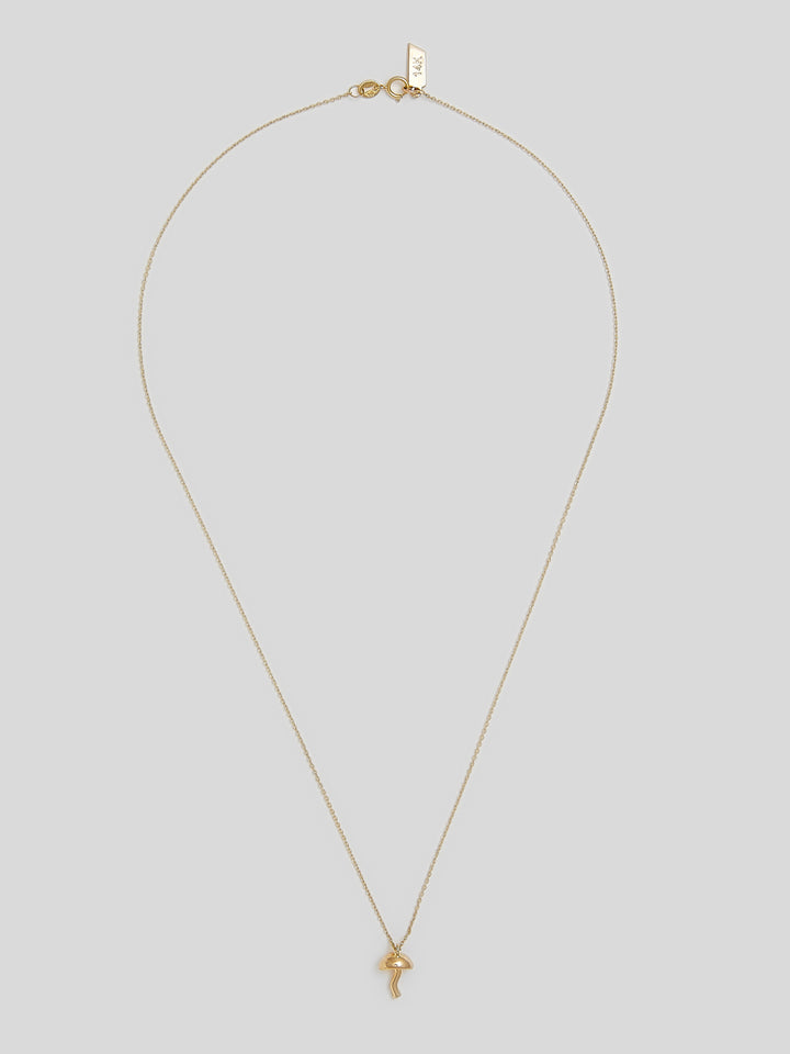 Product on image of thin yellow gold necklace with a small yellow gold mushroom pendant. 